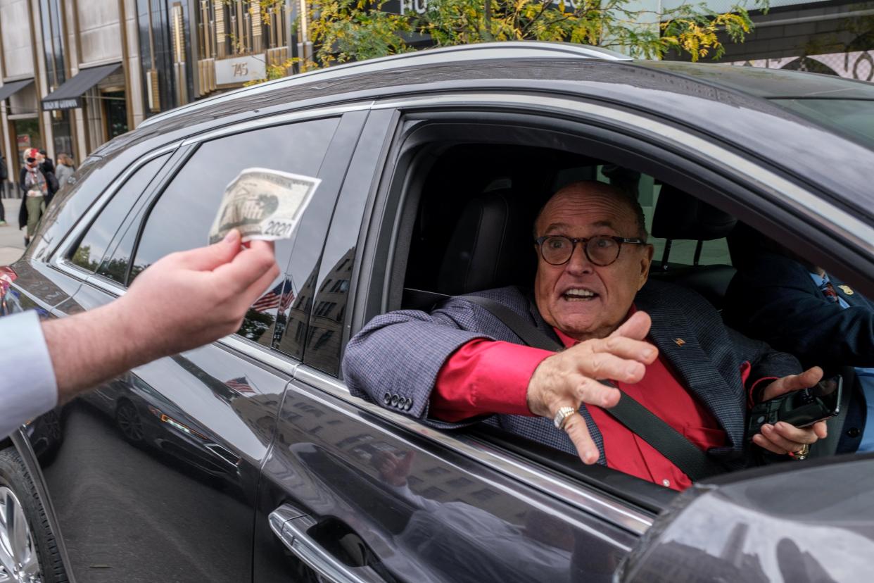 Former New York City Mayor Rudy Giuliani drives by a protest organized by supporters of U.S. President Donald Trump in front of Trump Tower in the Manhattan borough of New York City, U.S. October 25, 2020.  REUTERS/Yuki Iwamura (REUTERS)