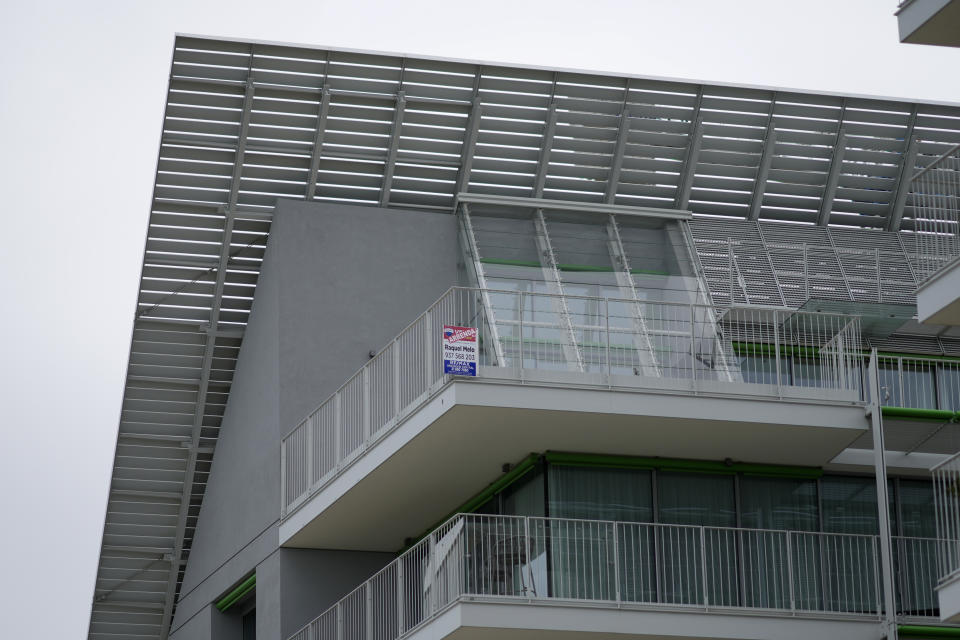 A "For Rent" ad is placed on a balcony at new luxury building by the Tagus river in Lisbon, Friday, March 10, 2023. Portugal’s center-left Socialist government is set to approve a package of measures to address the country's housing crisis. A growing number of people are being priced out of the property market by rising rents, surging house prices and climbing mortgage rates. (AP Photo/Armando Franca)