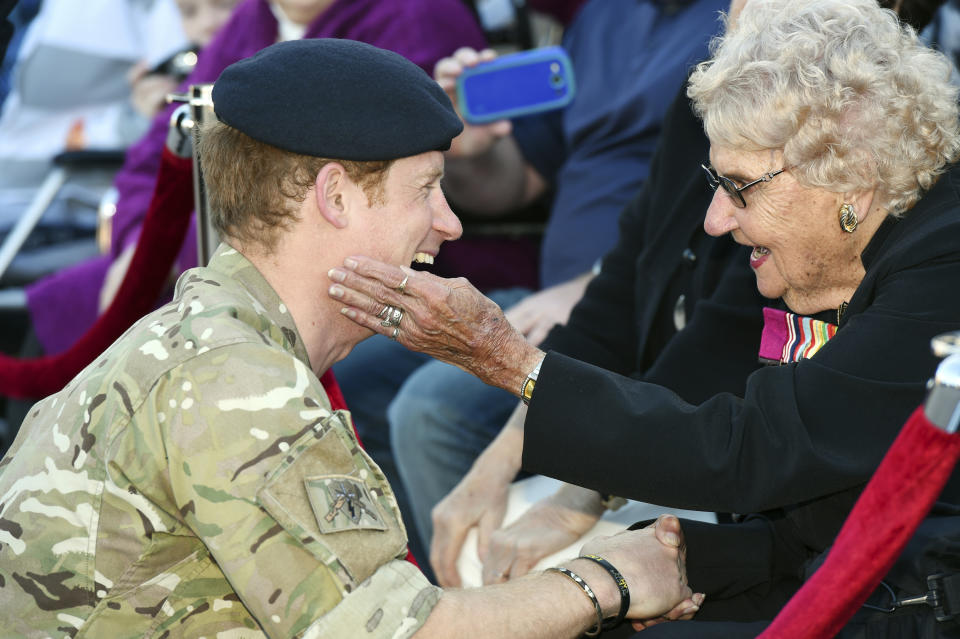 FILE - In this May 7, 2015, file photo, Britain's Prince Harry, left, talks with Australian war veteran Daphne Dunne during a visit to the Sydney Opera House in Sydney. There seems to be a special bond between Harry and Dunne, a war widow who gave him a warm hug Tuesday, Oct. 16, 2018, when they met in Sydney. It’s become a regular thing for the two of them. Dunne, tries to come cross the prince’s path whenever he comes to Australia. (Dean Lewins/Pool Photo via AP, File)