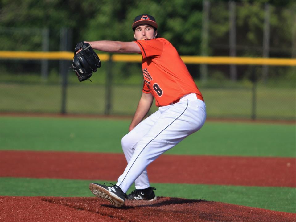 Taunton's Brady Morin winds up to throw a pitch during a Hockomock League game against Milford.