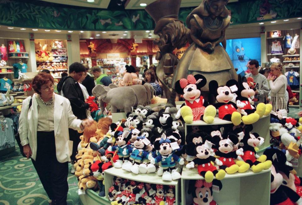 People shop inside a New York City Disney Store on June 18, 1997.