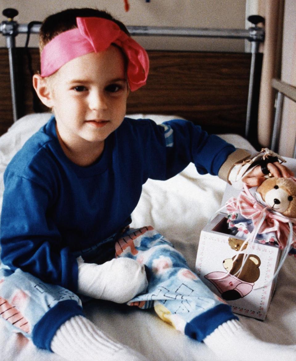 FILE- In this Oct. 9, 1987 file photo provided by the University of Michigan Medical Center, Cecelia Cichan, the sole survivor of Northwest Airlines flight 255 crash, that killed 154 people aboard and two on the ground, sits on her hospital bed before her release from the University of Michigan Medical Center in Ann Arbor, Mich. In the new documentary, “Sole Survivor,” Cichan, whose married name is Crocker, breaks her silence, discussing how the crash of the Phoenix-bound jetliner has affected her. (AP Photo, University of Michigan Medical Center, File) NO SALES