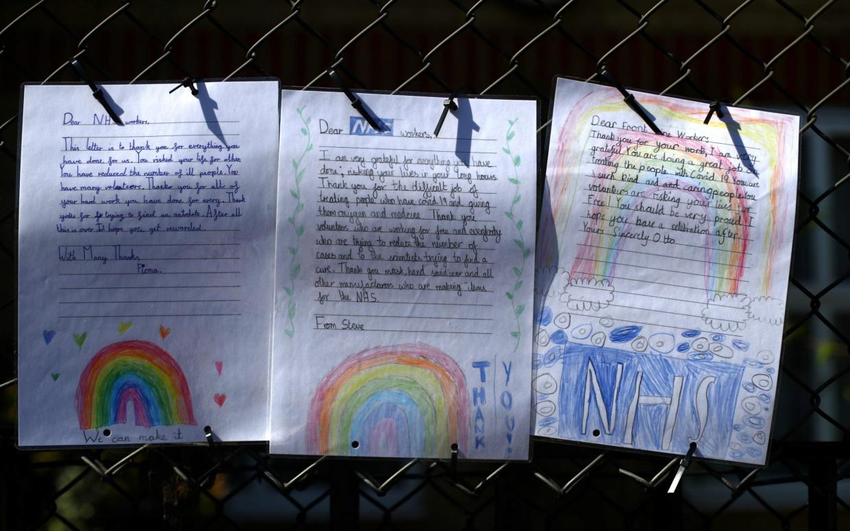 Letters from children to the NHS during the coronavirus pandemic. A new study has shown there is no evidence of children passing the virus to adults - Hannah McKay/Reuters