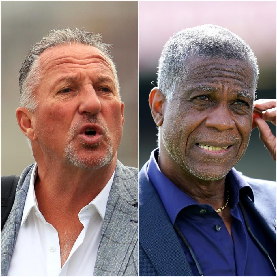 Ian Botham and Michael Holding (PA)