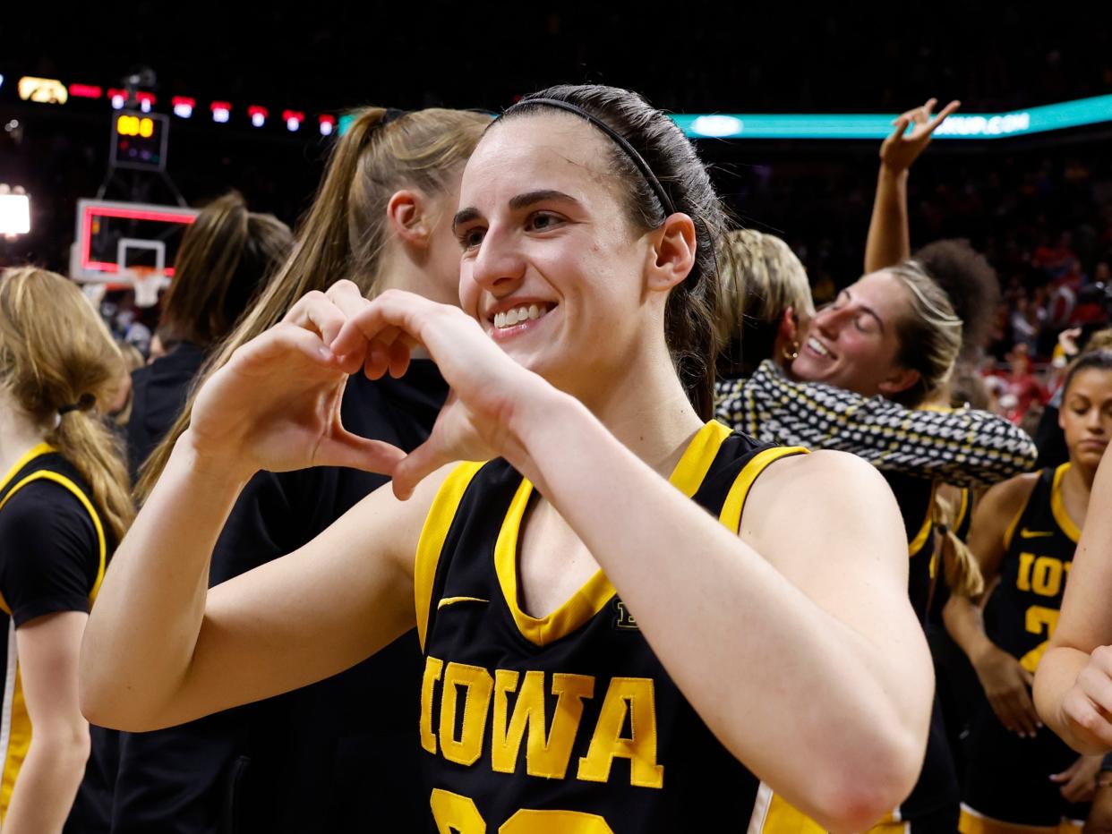 Caitlin Clark #22 of the Iowa Hawkeyes celebrates a 67-58 win over the Iowa State Cyclones at Hilton Coliseum on December 6, 2023