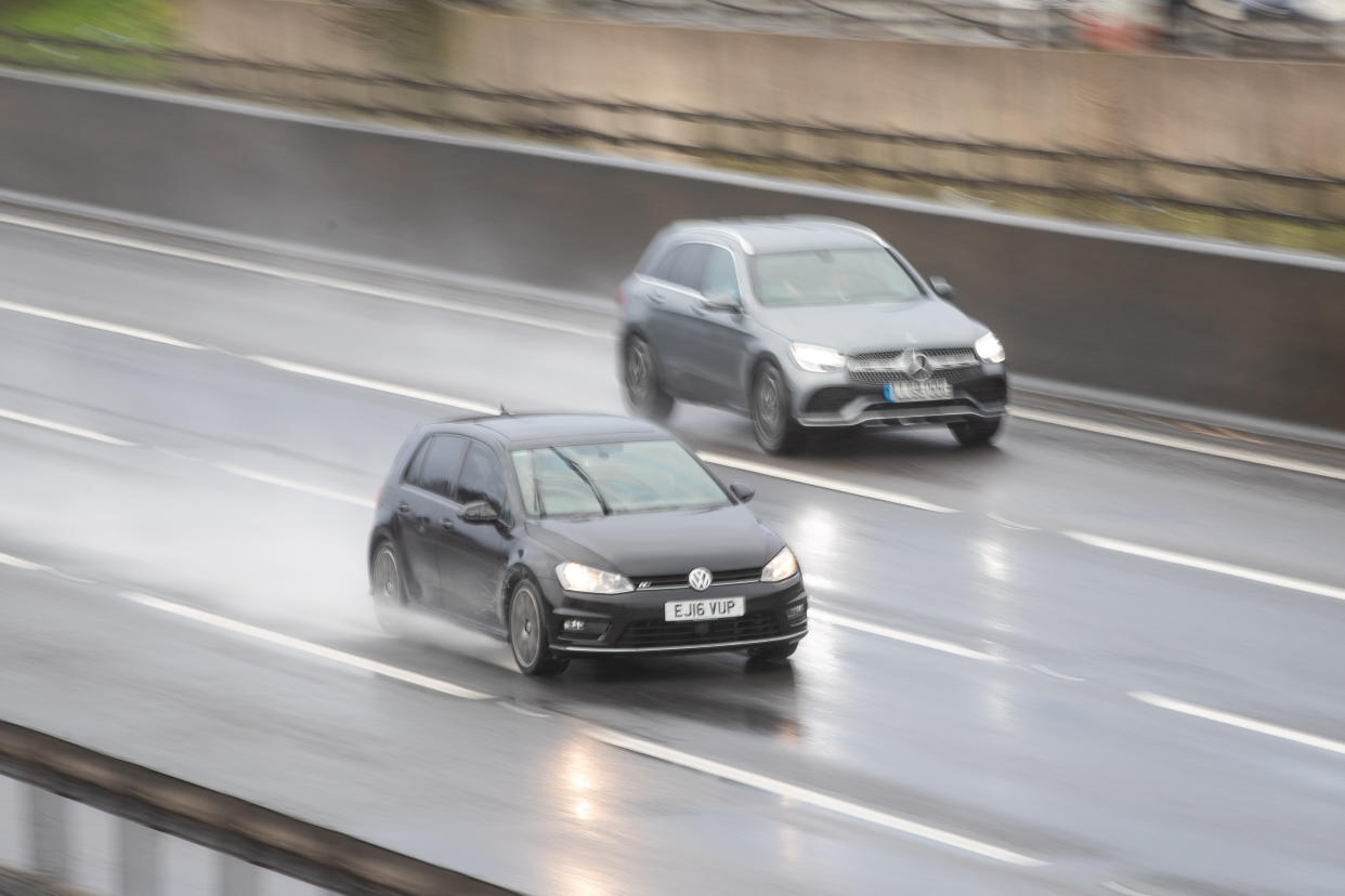 Cars travel along the M1 motorway through wet and windy weather. (Photo by Aaron Chown/PA Images via Getty Images)