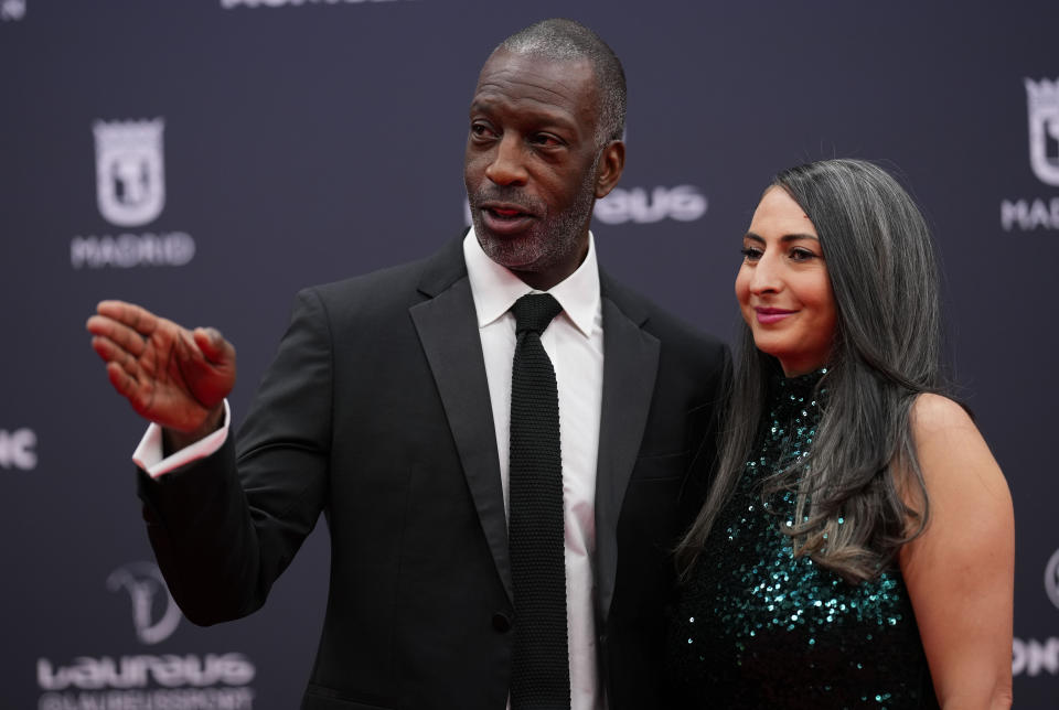 FILE - Former U.S. athlete Michael Johnson, left, and wife Armine Shamiryan arrive at the Laureus Sports Awards ceremony in Madrid, Monday, April 22, 2024. Sprinting great Michael Johnson is launching a track league that looks to assemble nearly 100 of the sport's top performers four times a year to compete for $12.6 million in prize money over its first season. The league, Grand Slam Track, announced Tuesday, June 18, that it will launch next April with plans for one event in Los Angeles, the home of the 2028 Olympics, one in another American city and two more overseas. (AP Photo/Manu Fernandez, File)