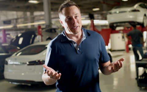 Elon Musk at Tesla factory - Credit: Bloomberg