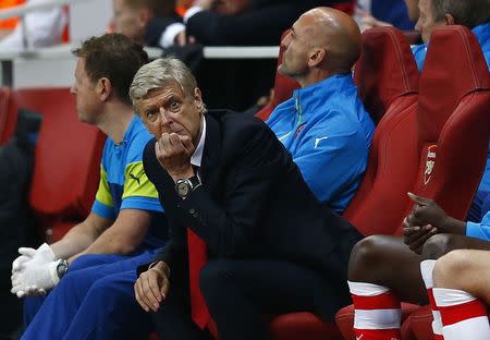 Arsenal manager Arsene Wenger reacts during their Champions League playoff soccer match against Besiktas at the Emirates stadium in London August 27, 2014. REUTERS/Eddie Keogh