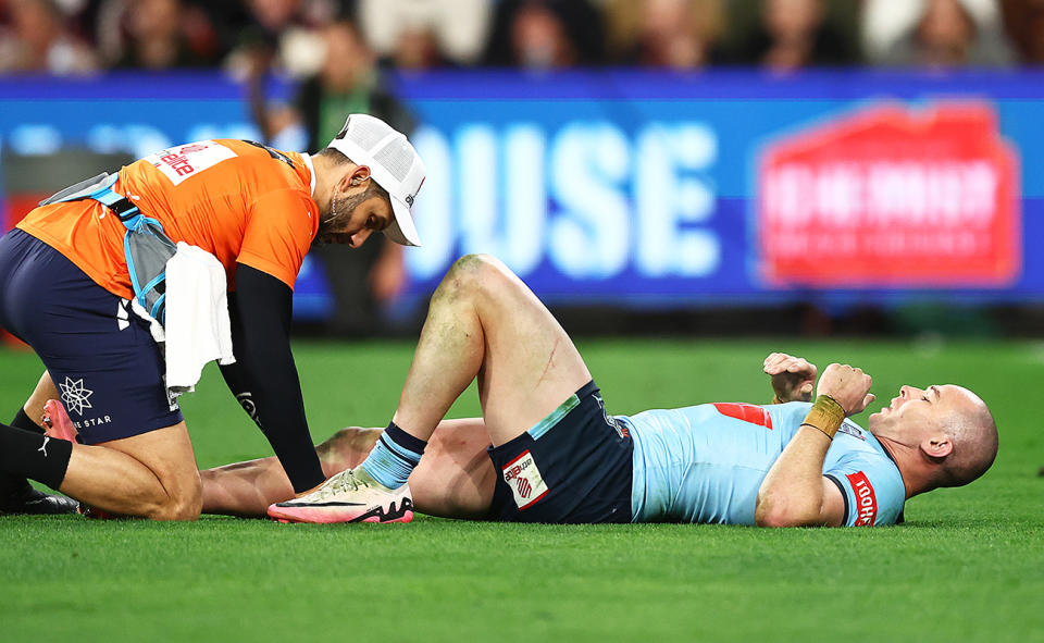 Dylan Edwards, pictured here after suffering a knee injury in the State of Origin decider.