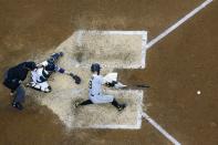 Pittsburgh Pirates' Colin Moran hits an RBI double during the 10th inning of a baseball game against the Milwaukee Brewers Sunday, April 18, 2021, in Milwaukee. (AP Photo/Morry Gash)