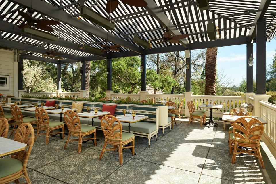 Outdoor dining on a deck of The Madrona Hotel