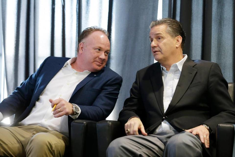 Football coach Mark Stoops and basketball coach John Calipari chatted during a UK uniform unveiling event in 2016.