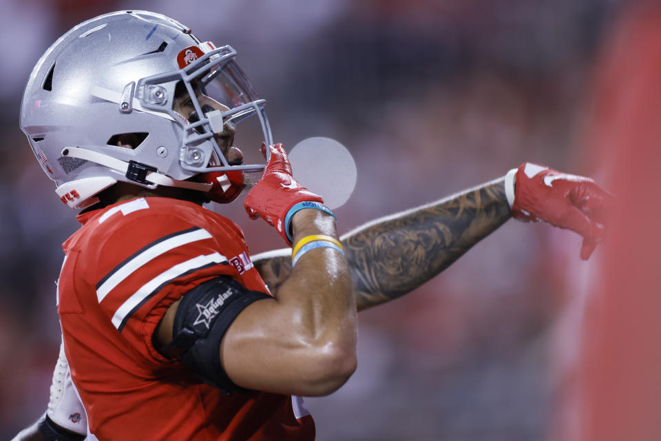 Ohio State receiver Julian Fleming celebrates his touchdown against Toledo during the first half of an NCAA college football game Saturday, Sept. 17, 2022, in Columbus, Ohio. (AP Photo/Jay LaPrete)