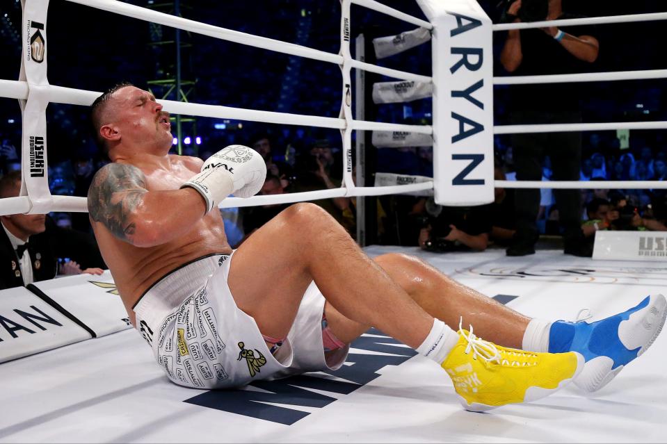 Usyk took four minutes to recover from the alleged low blow, which seemed to land on the belt line (Getty Images)
