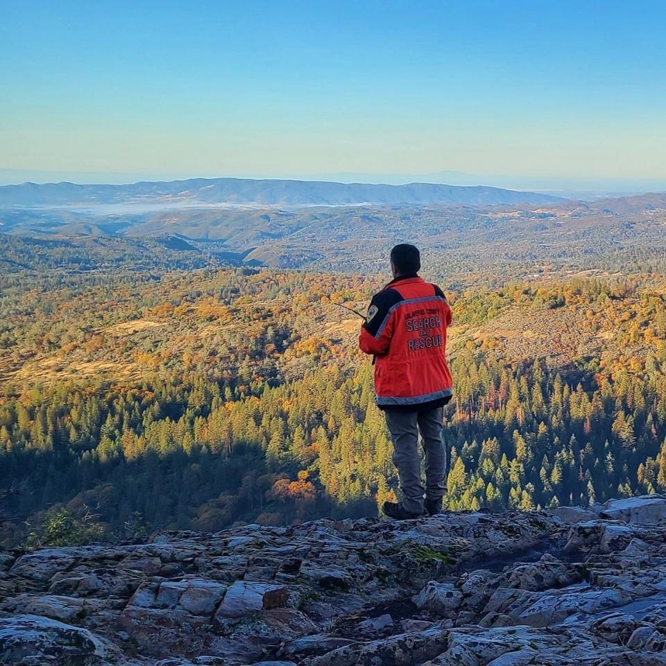 A member of the Calaveras County Sheriff's Office Search and Rescue looks out over the vast wilderness near the town of Arnold during the search for Ann Herford. The traveling nurse from Michigan was reported missing Nov. 14 after she didn't show up to work.