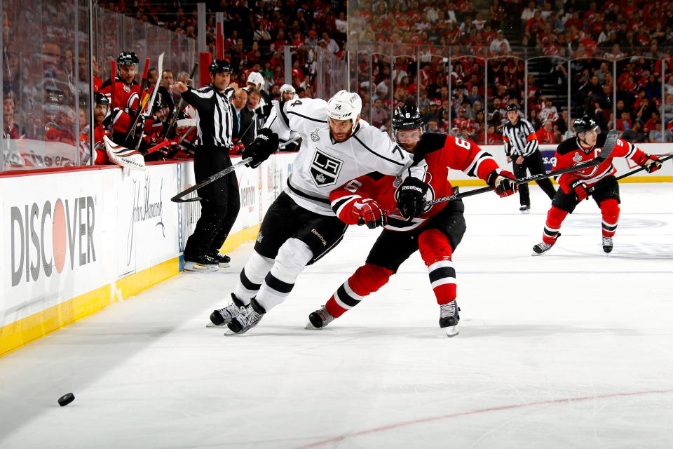 NEWARK, NJ - JUNE 09: Dwight King #74 of the Los Angeles Kings fights for position against Andy Greene #6 of the New Jersey Devils during Game Five of the 2012 NHL Stanley Cup Final at the Prudential Center on June 9, 2012 in Newark, New Jersey. (Photo by Bruce Bennett/Getty Images)