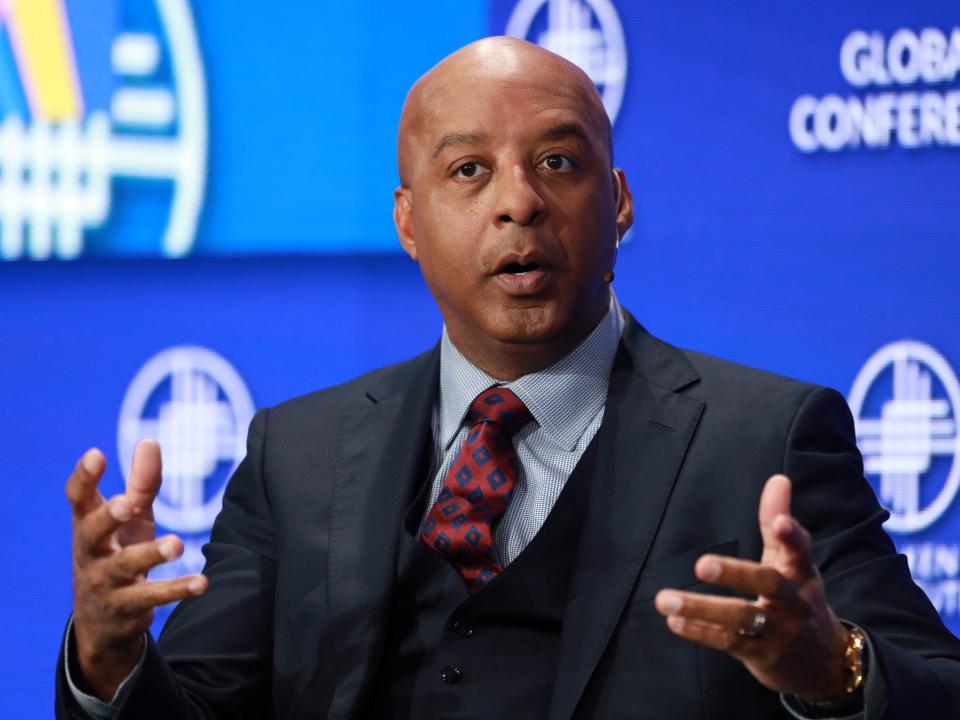 Lowe's CEO Marvin Ellison gestures while sitting on stage at conference