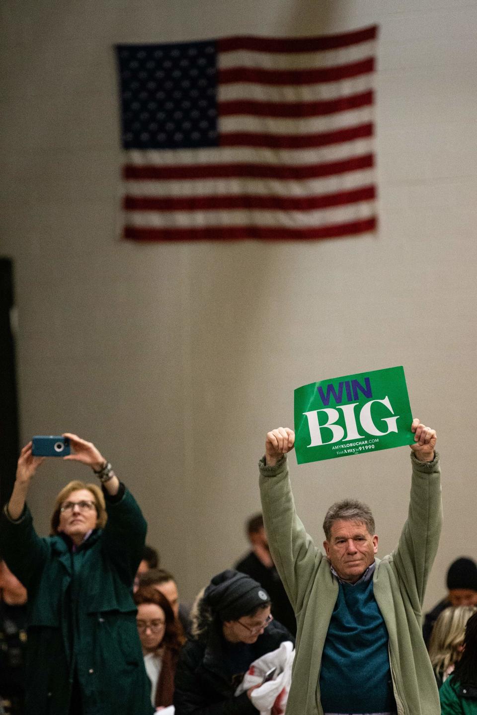 Disapointed supporters hold signs as they face off with protestors who took over the stage forcing Democratic presidential hopeful Minnesota Senator Amy Klobuchar to cancel her rally before it even started on March 1, 2020 in St. Louis Park, west of Minneapolis, Minnesota. - Hundreds of Klobuchar supporters witnessed a group of Black Lives Matter protesters demanding her to drop out of the race after her misshandling of Myon Burrell's case in 2002 when she was County Attorney. (Photo by Kerem Yucel / AFP) (Photo by KEREM YUCEL/AFP via Getty Images)