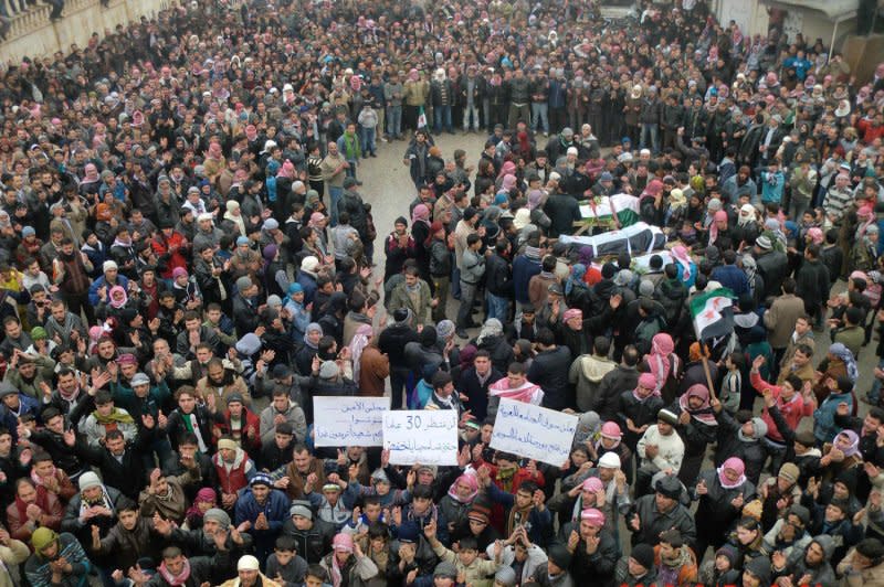Syrian mourners gather around the bodies of people allegedly killed by Syrian government forces during a funeral procession in Maarat al-Noman, Idlib province, Syria, on February 7, 2012. On February 4, 2012, Russia and China vetoed an effort by the U.N. Security Council to end the violence in Syria with an Arab League peace plan. UPI File Photo