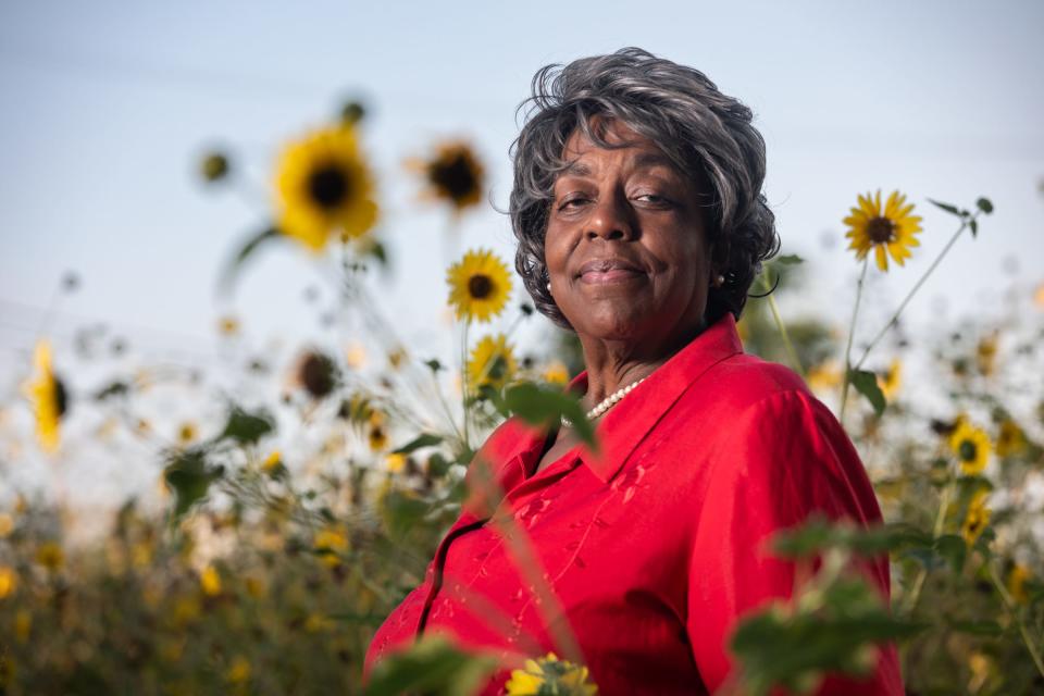 Alice Upshaw Hawkins, 73, of Corpus Christi, stands among sunflowers on Tuesday, May 30, 2023, in Texas. Upshaw Hawkins was recently elected the first Black president of the League of Women Voters of Corpus Christi. 