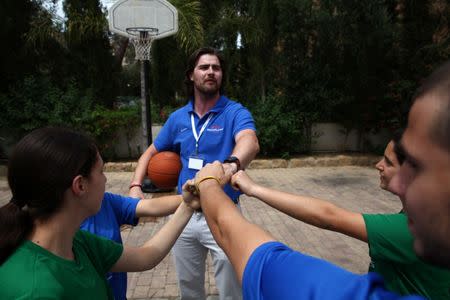 Greek and Turkish Cypriots young players called PeacePlayers Cyprus participate in a basketball event organised by EBRD, inside the UN-controlled buffer zone in Nicosia, Cyprus May 9, 2017. REUTERS/Yiannis Kourtoglou