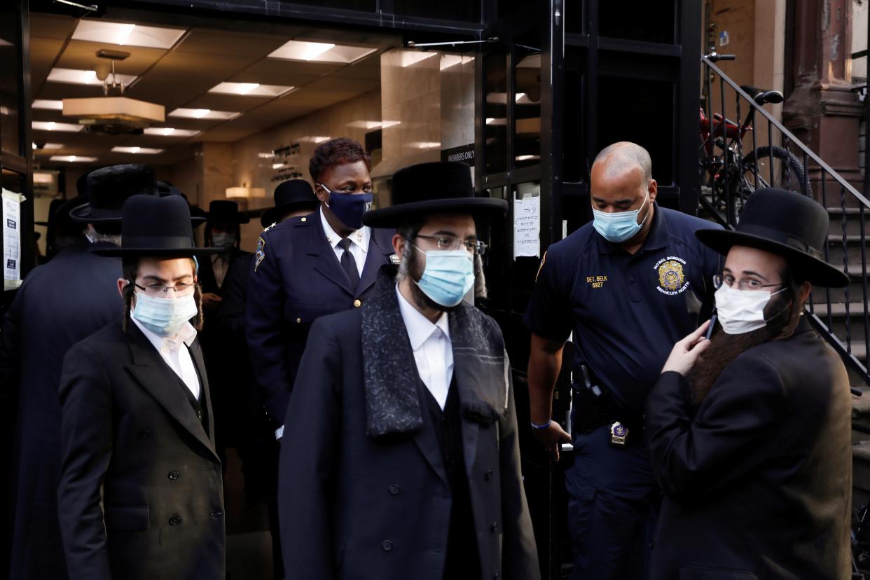 Members of the New York Police Department (NYPD) check the Congregation Yetev Lev D'Satmar synagogue, reportedly the original site of the wedding of the grandchild of Zalman Leib Teitelbaum, a grand rabbi of the Satmar Hasidic Jewish congregation, which was canceled due to restrictions on public gathering during the outbreak of the coronavirus disease (COVID-19) in the South Williamsburg neighborhood of Brooklyn, New York City, U.S., October 19, 2020. REUTERS/Andrew Kelly (REUTERS)