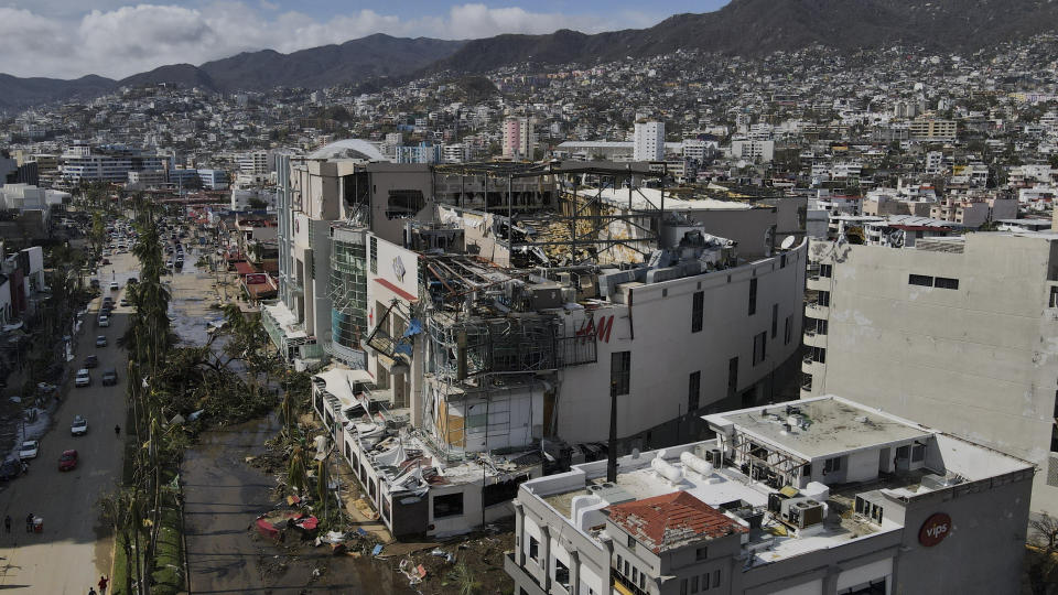 Damaged buildings stand after Hurricane Otis ripped through Acapulco, Mexico, Thursday, Oct. 26, 2023. The hurricane that strengthened swiftly before slamming into the coast early Wednesday as a Category 5 storm has killed at least 27 people as it devastated Mexico's resort city of Acapulco. (AP Photo/Felix Marquez)