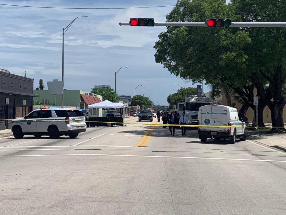 Miami police detectives investigate the shooting of a man found dead on Northwest Seventh Avenue just south of 58th Street in Liberty City, Monday afternoon, July 1, 2024.