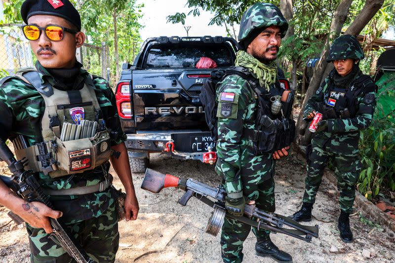 Soldiers from the Karen National Liberation Army (KNLA) prepare to patrol Myawaddy, the Thailand-Myanmar border town under the control of a coalition of rebel forces led by the Karen National Union