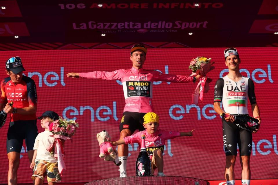 Overall winner JumboVismas Slovenian rider Primoz Roglic C celebrates on the podium after winning the Giro dItalia 2023 cycling race in Rome on May 28 2023 as secondplaced INEOS Grenadierss British rider Geraint Thomas L and thirdplaced UAE Team Emiratess Portuguese rider Joao Almeida look on Photo by Luca Bettini  AFP Photo by LUCA BETTINIAFP via Getty Images