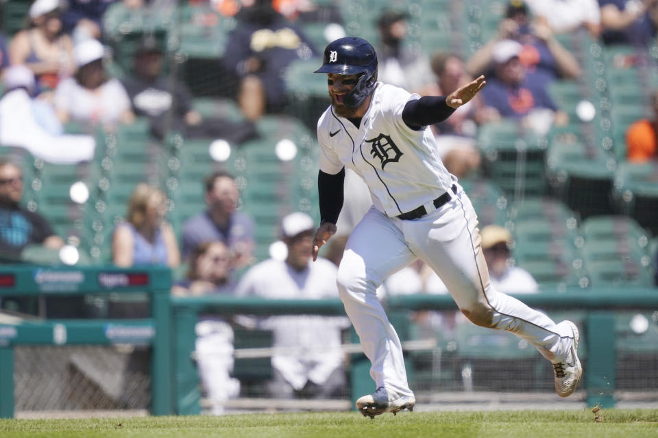 Detroit Tigers' Eric Haase heads home to score during the third inning of a baseball game against the New York Yankees, Sunday, May 30, 2021, in Detroit. (AP Photo/Carlos Osorio)