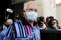 Former Malaysian Prime Minister Najib Razak leaves after a meeting at United Malays National Organization (UMNO) headquarters in Kuala Lumpur