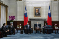 In this photo released by the Taiwan Presidential Office, Taiwan's President Tsai Ing-wen, right, meets with a Japanese delegation led by lawmaker and former Defense Minister Shigeru Ishiba, third from left, at the presidential office in Taipei, Taiwan Thursday, July 28, 2022. The group of Japanese lawmakers including two former defense ministers met with Taiwan's president on Thursday in a rare high-level visit to discuss regional security. (Taiwan Presidential Office via AP)