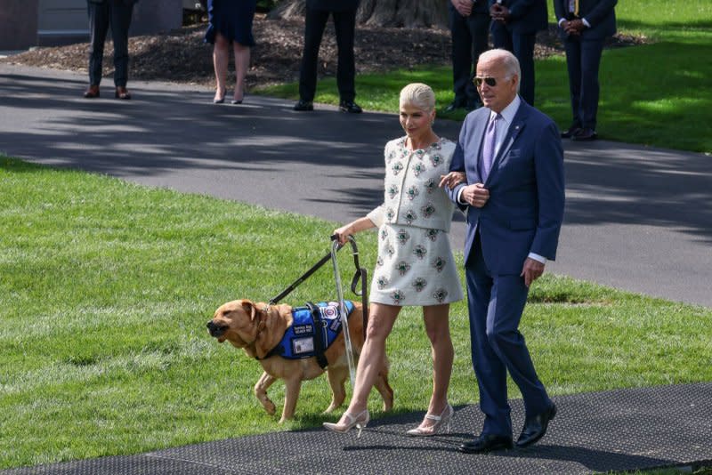 President Joe Biden (R) and actress Selma Blair, who suffers from multiple sclerosis, walk across the South Lawn on Monday to deliver remarks at a reception for the Americans with Disabilities Act at the White House in Washington, D.C. Photo by Jemal Countess/UPI