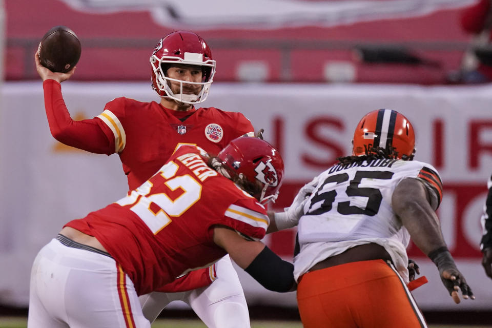 Kansas City Chiefs quarterback Chad Henne throws a pass during the second half of an NFL divisional round football game against the Cleveland Browns, Sunday, Jan. 17, 2021, in Kansas City. (AP Photo/Charlie Riedel)