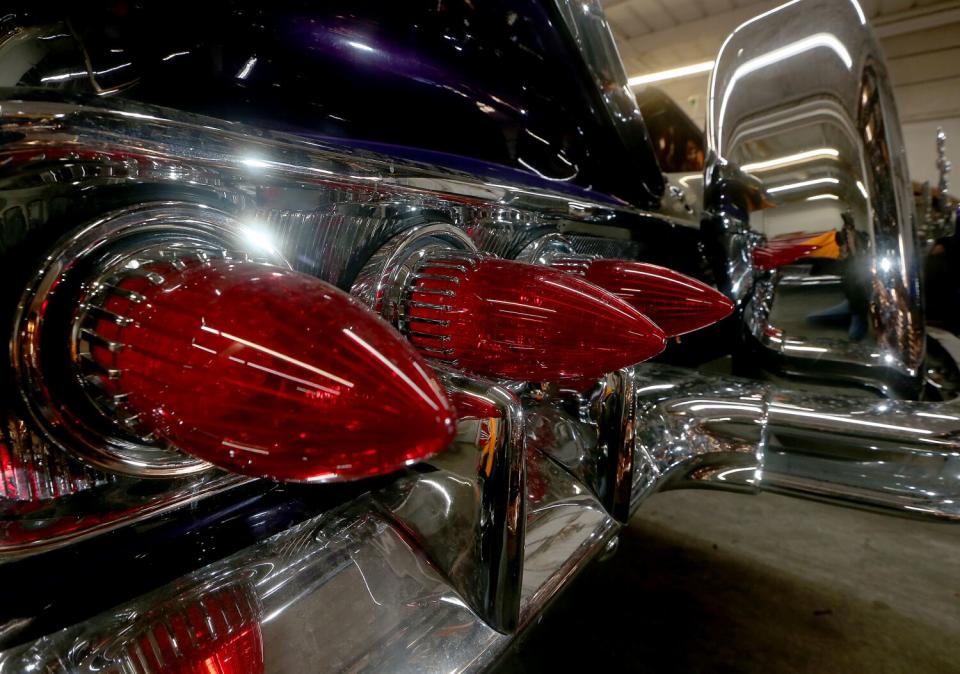 The taillights, rear bumper and spare tire cover of a customized Chevrolet Impala