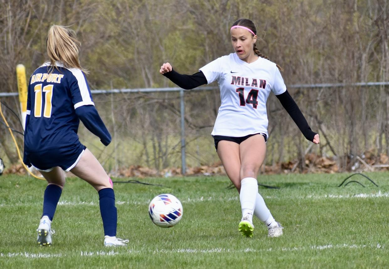 Milan's Molly Walline tries to get past Makayla Harrelson of Airport during a 5-2 Milan victory on Wednesday, April 24, 2024.