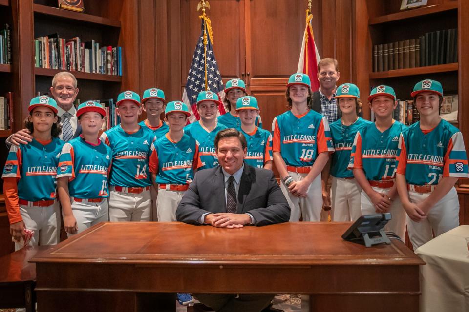 Martin County North Little League, the Florida state champions that made it to the 2021 Little League World Series, have their photo taken with Gov. Ron DeSantis at the governor's mansion in Tallahassee, on Thursday, Nov. 4, 2021.