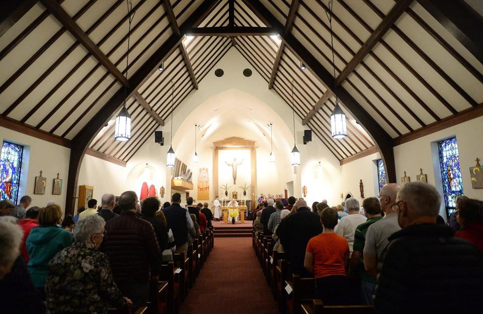 Mass is celebrated during Holy Week in 2017 at St. Mark the Evangelist Catholic Church in Lawrence Park Township. St. Mark will become a secondary mission church of St. James Parish in Erie.