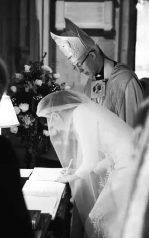 Meghan Markle signs the register, watched by Archbishop Justin Welby - Credit: Chris Allerton