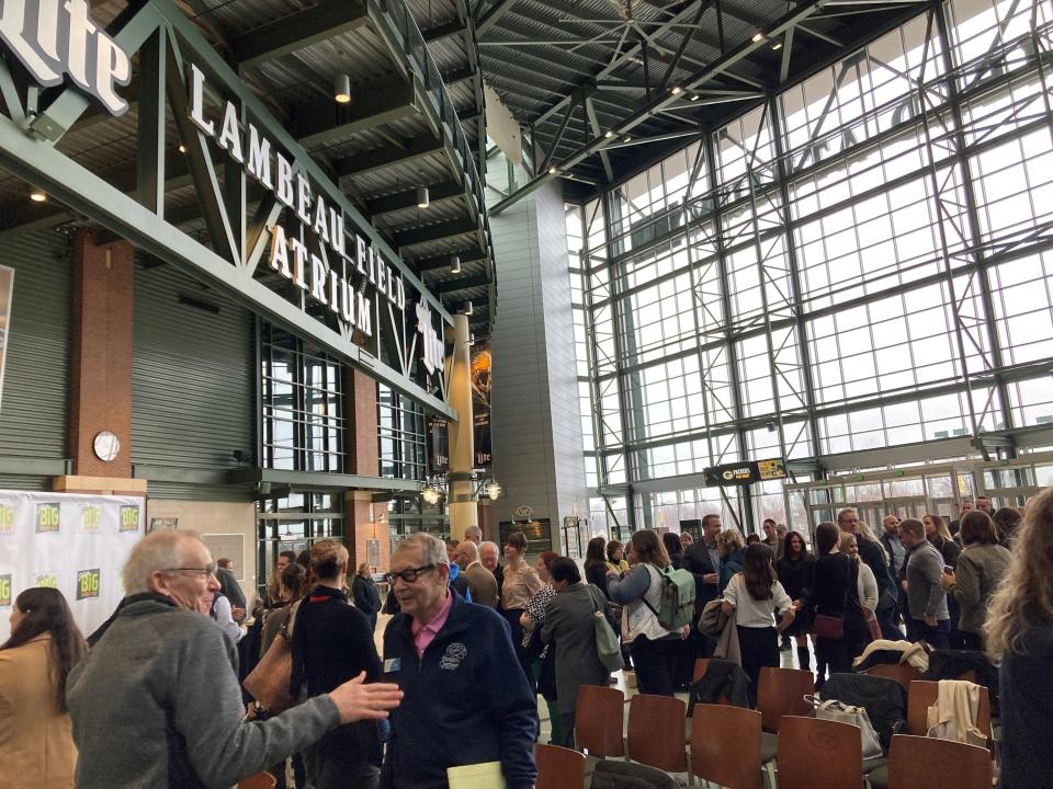 Crowd mingles following Tuesday's Give BIG Green Bay press conference on Tues., Jan. 17, at the Lambeau Field Atrium in Green Bay.