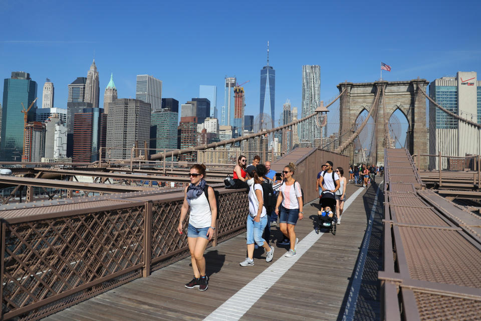 <p>People head toward Brooklyn from Manhattan across the Brooklyn Bridge in New York City, on Sept. 5, 2017. (Photo: Gordon Donovan/Yahoo News) </p>