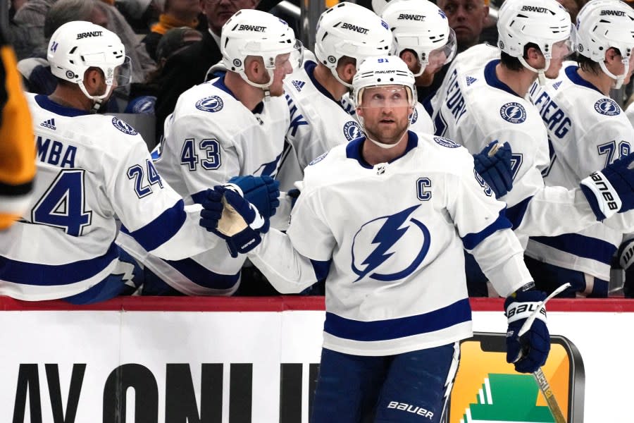 Tampa Bay Lightning’s Steven Stamkos (91) returns to the bench after scoring during the second period of an NHL hockey game against the Pittsburgh Penguins in Pittsburgh, Saturday, April 6, 2024. (AP Photo/Gene J. Puskar)