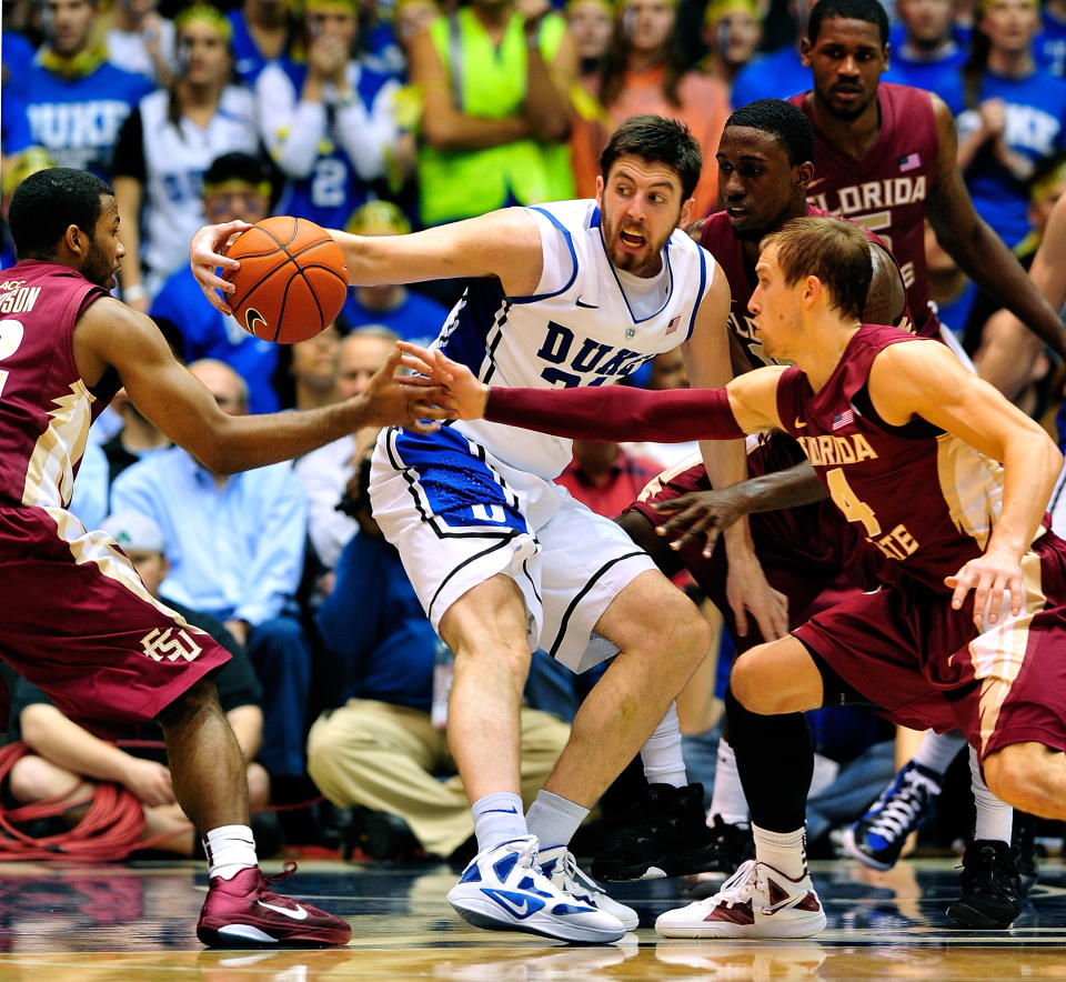 DURHAM, NC - JANUARY 21: Jeff Peterson #12, Okaro White #10 and Deivdas Dulkys #4 of the Florida State Seminoles pressure Ryan Kelly #34 of the Duke Blue Devils during play at Cameron Indoor Stadium on January 21, 2012 in Durham, North Carolina. Florida State won 76-73 to end Duke's 44-game home winning streak. (Photo by Grant Halverson/Getty Images)