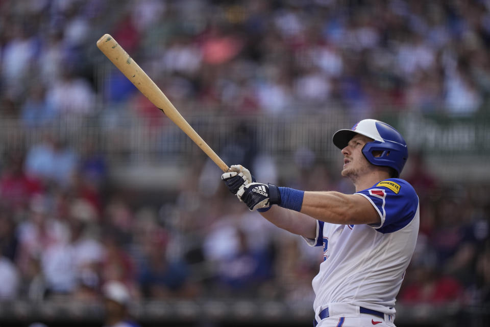 Atlanta Braves' Sean Murphy (12) hits a solo home run in the ninth inning of a baseball game against the Philadelphia Phillies, Saturday, May 27, 2023, in Atlanta. (AP Photo/Brynn Anderson)