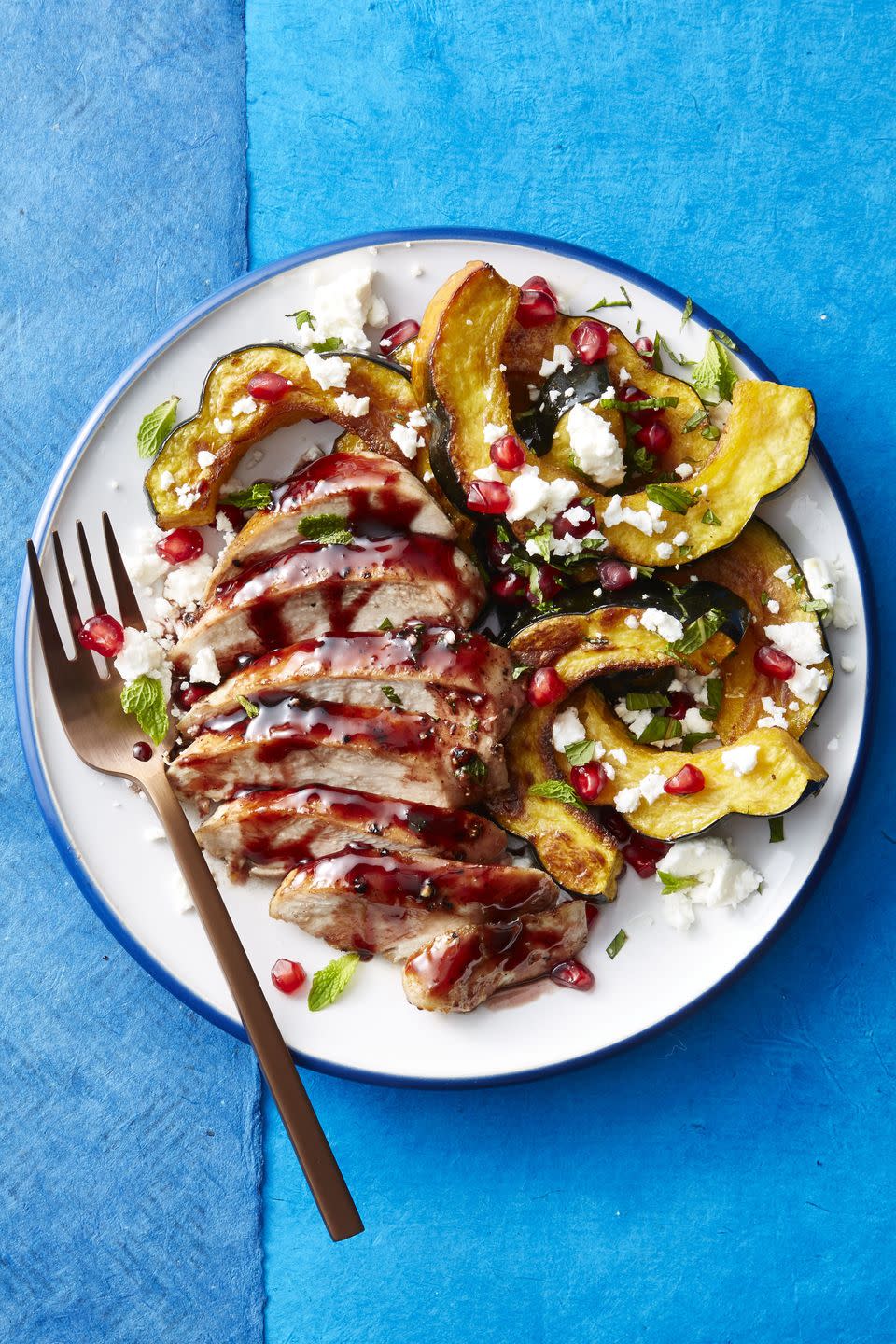 <p>This mouthwatering recipe uses a pomegranate and honey glaze (with crumbled feta and chopped mint!) over golden brown chicken breast and acorn squash ... Um, yes please. </p><p>Get the <a href="https://www.goodhousekeeping.com/food-recipes/easy/a46930/pomegranate-honey-glazed-chicken-and-squash-recipe/" rel="nofollow noopener" target="_blank" data-ylk="slk:Pomegranate-Honey Glazed Chicken and Squash recipe;elm:context_link;itc:0;sec:content-canvas" class="link "><strong>Pomegranate-Honey Glazed Chicken and Squash recipe</strong></a><em>.</em></p>