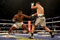 <p>Anthony Joshua (left) looked a little sharper in the early stages of the clash with Joseph Parker </p>