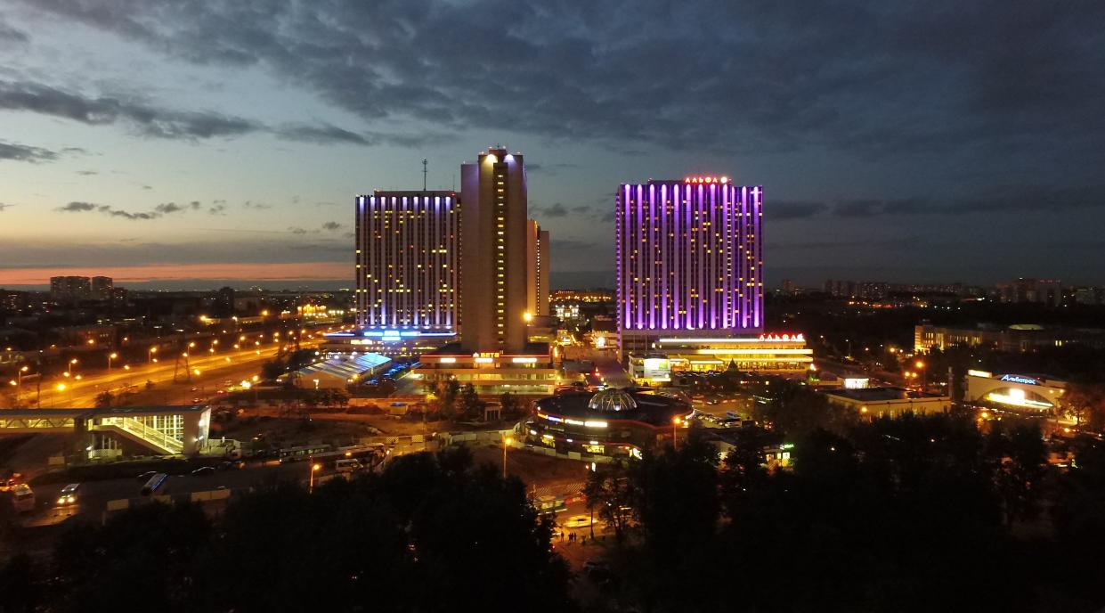 Nighttime drone shot of Izmailovo Hotel.