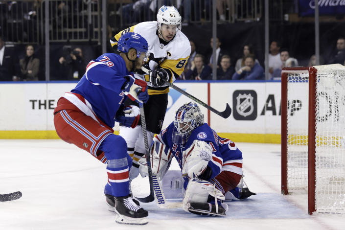 New York Rangers goaltender Igor Shesterkin stops a shot by Pittsburgh Penguins center Sidney Crosby (87) during the third period in Game 7 of an NHL hockey Stanley Cup first-round playoff series, Sunday, May 15, 2022, in New York. (AP Photo/Adam Hunger)